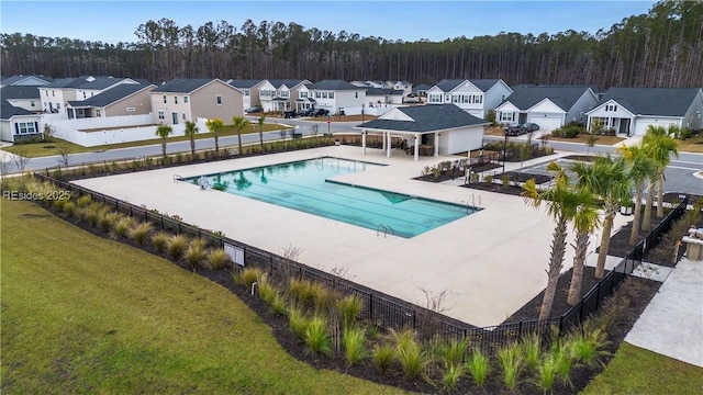 view of swimming pool with a yard and a patio area