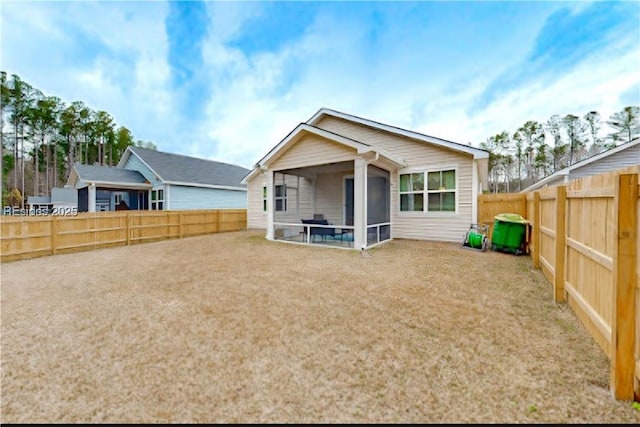 rear view of house with a sunroom