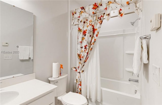 full bathroom with vanity, shower / bath combo with shower curtain, and toilet