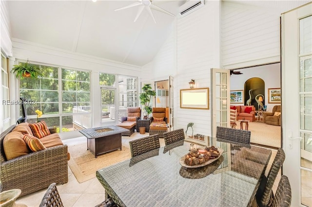 sunroom / solarium featuring lofted ceiling and ceiling fan