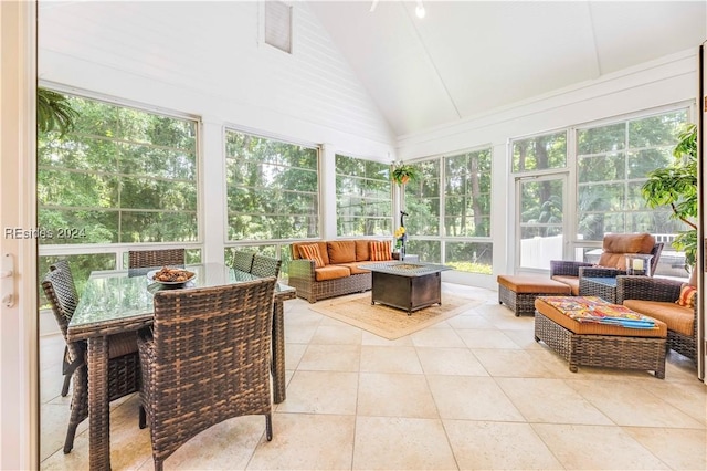 sunroom featuring lofted ceiling