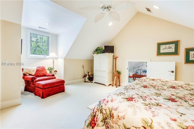 bedroom with ceiling fan, lofted ceiling, and carpet flooring