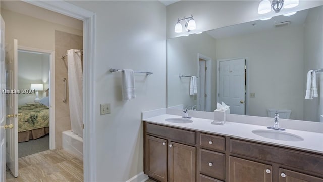 bathroom with vanity and shower / tub combo