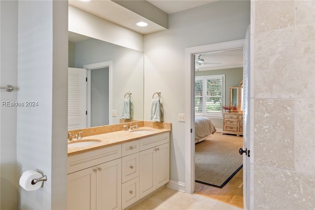 bathroom with vanity, crown molding, and tile patterned floors