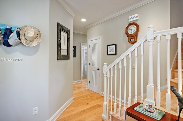 hall featuring hardwood / wood-style flooring and crown molding