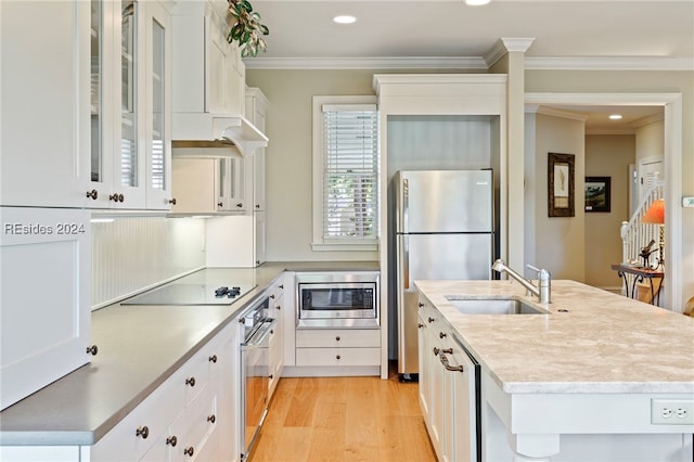 kitchen with white cabinetry, sink, and stainless steel appliances