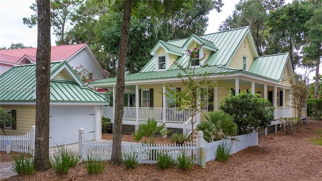 view of front of property with a garage and a porch