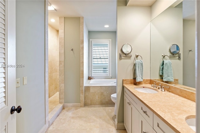 full bathroom featuring toilet, vanity, shower with separate bathtub, and tile patterned flooring