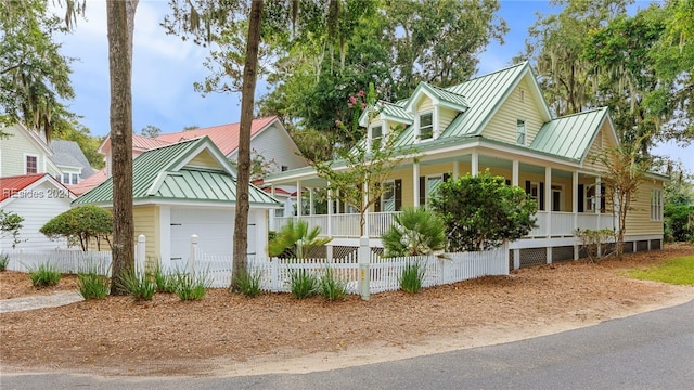 view of front facade featuring a garage and covered porch