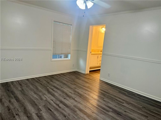 unfurnished room featuring ceiling fan, ornamental molding, and dark hardwood / wood-style flooring