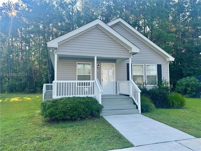 view of front facade with a porch and a front yard