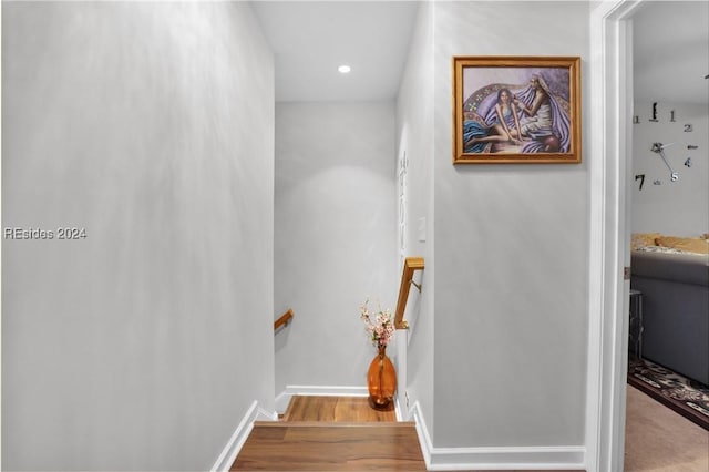 stairway with wood-type flooring