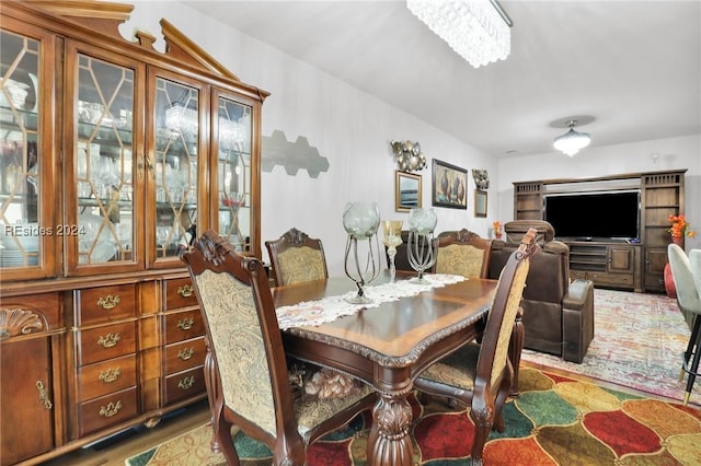 dining area featuring a notable chandelier