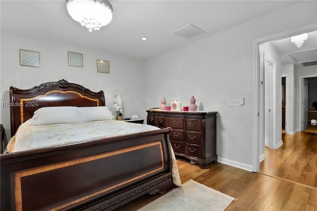 bedroom featuring hardwood / wood-style flooring