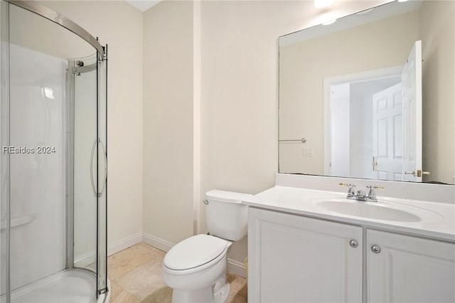 bathroom featuring vanity, toilet, and walk in shower