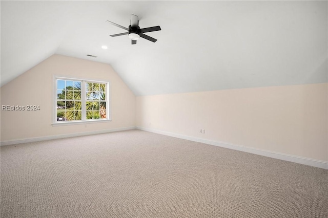 bonus room featuring vaulted ceiling, light colored carpet, and ceiling fan