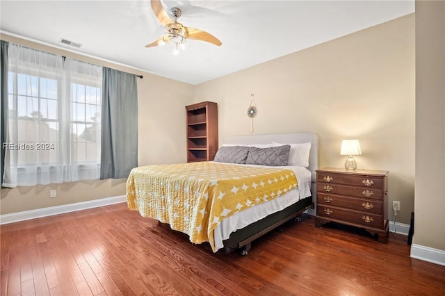 bedroom featuring dark wood-type flooring and ceiling fan