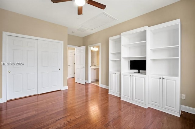 unfurnished bedroom featuring dark hardwood / wood-style flooring, connected bathroom, a closet, and ceiling fan