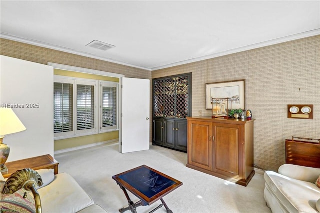 carpeted living room with ornamental molding