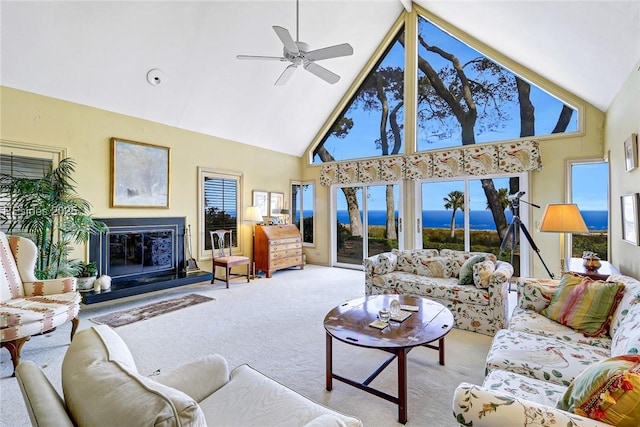 living room featuring light carpet, high vaulted ceiling, and ceiling fan