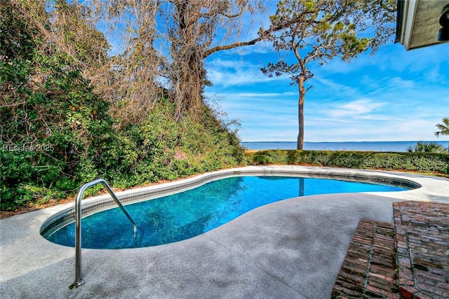 view of pool featuring a water view