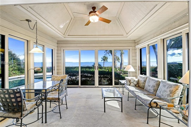 sunroom with wooden ceiling and ceiling fan