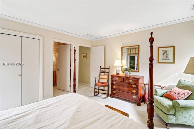 bedroom with crown molding, light colored carpet, and a closet