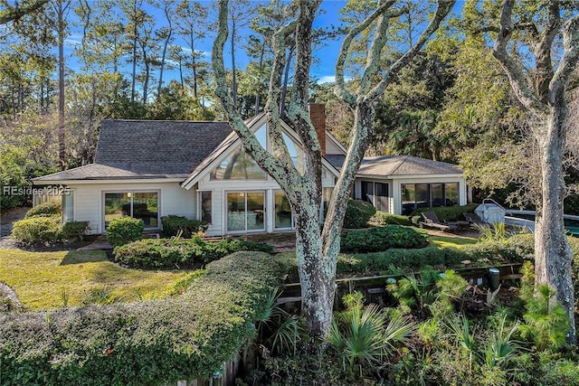 view of front of property featuring a sunroom