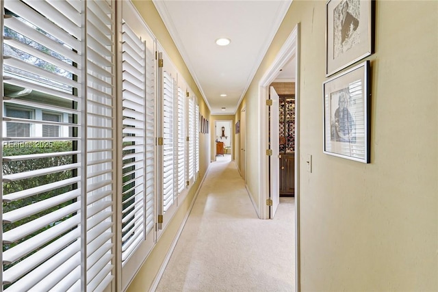 corridor with light carpet and ornamental molding