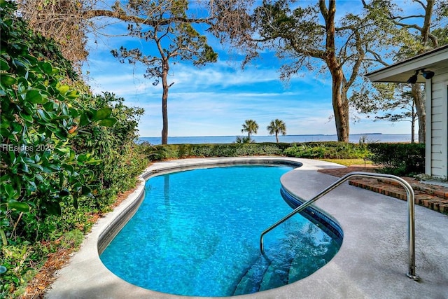 view of pool featuring a water view