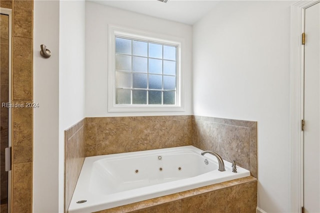 bathroom with tiled tub