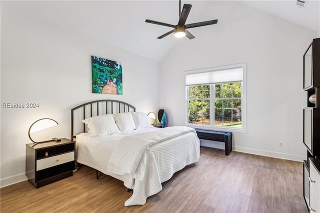 bedroom featuring lofted ceiling, hardwood / wood-style flooring, and ceiling fan