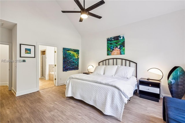 bedroom with ceiling fan, ensuite bathroom, high vaulted ceiling, and light hardwood / wood-style flooring