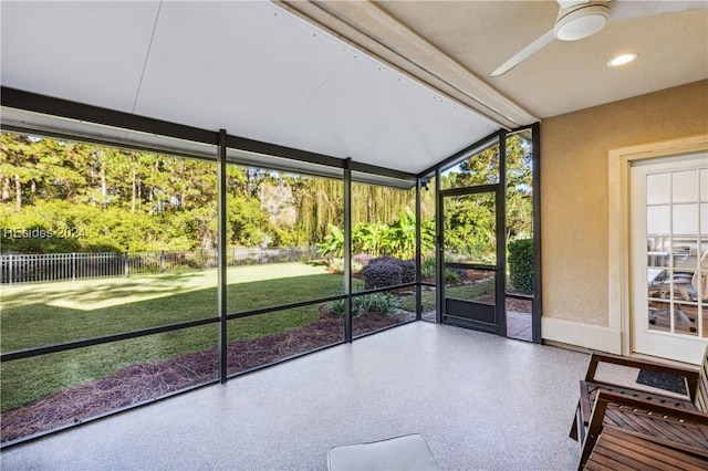 unfurnished sunroom featuring vaulted ceiling and ceiling fan