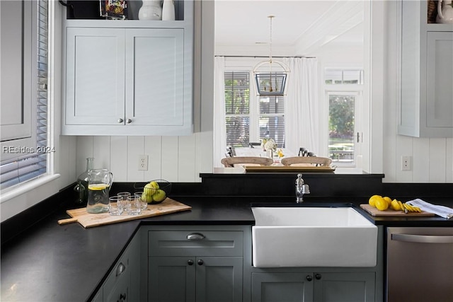 kitchen with gray cabinetry, sink, and stainless steel dishwasher