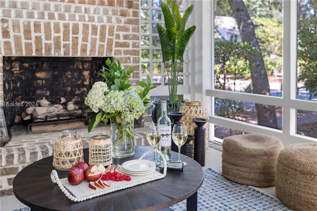 interior details featuring a brick fireplace