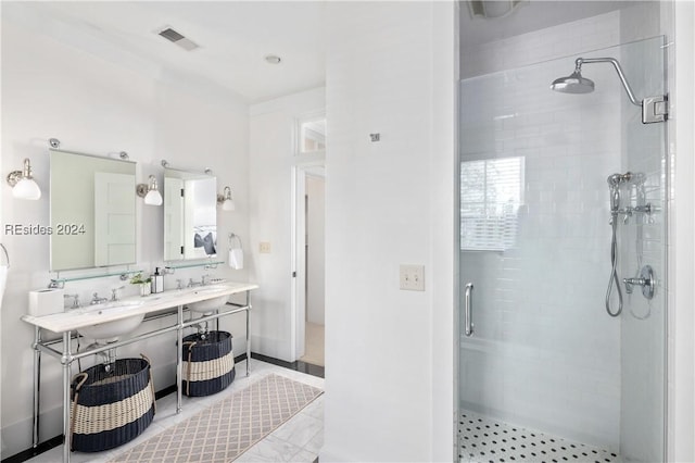 bathroom with tile patterned floors, an enclosed shower, and sink