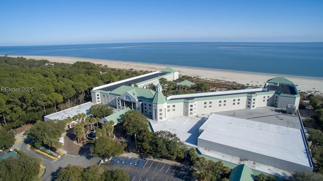 drone / aerial view with a beach view and a water view