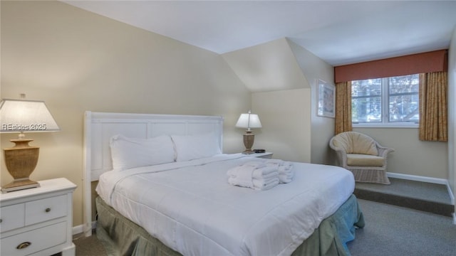 bedroom featuring lofted ceiling and light colored carpet