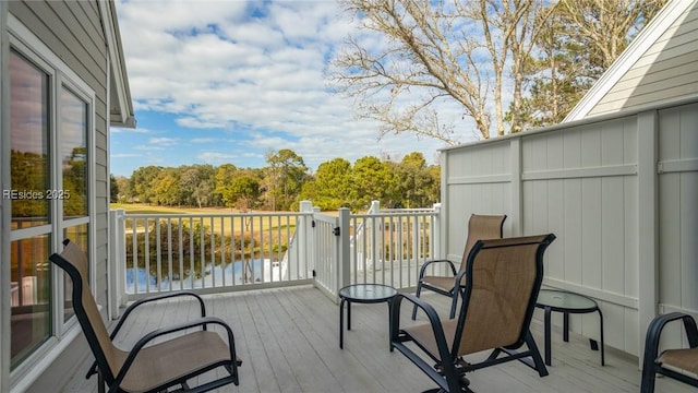 wooden terrace with a water view