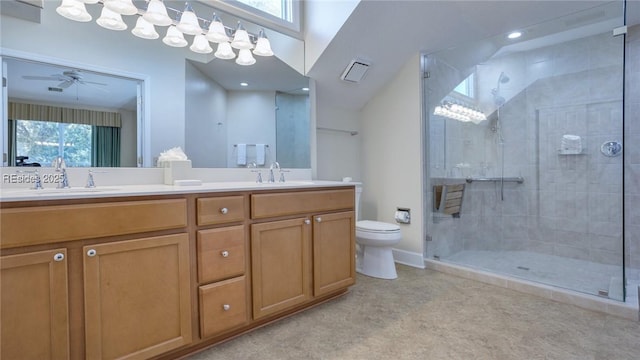 bathroom featuring walk in shower, ceiling fan, vanity, and toilet