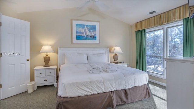 carpeted bedroom featuring vaulted ceiling