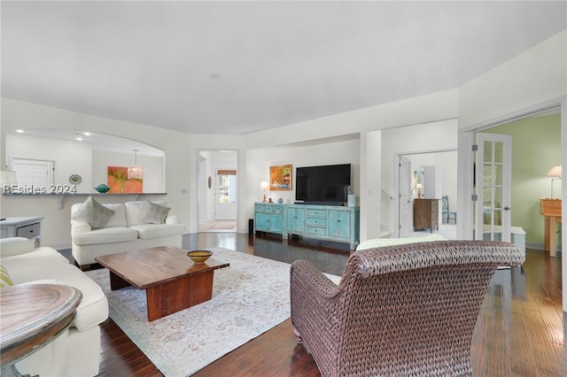 living room with dark hardwood / wood-style flooring