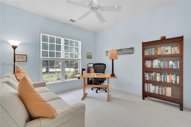 office space featuring ceiling fan and light colored carpet