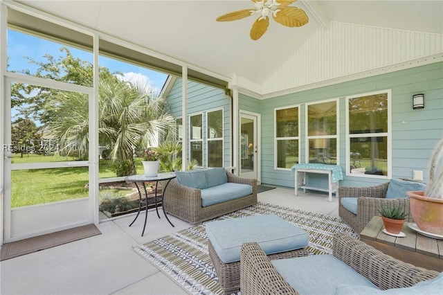 sunroom with vaulted ceiling with beams and ceiling fan