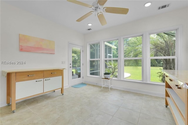 interior space featuring ceiling fan