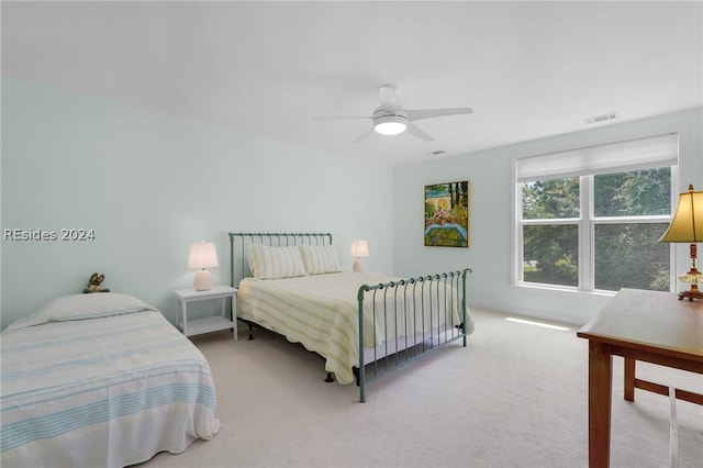 bedroom with ceiling fan and carpet