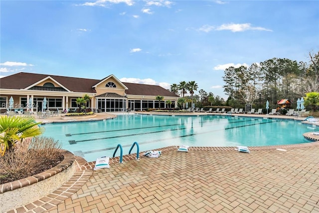 view of swimming pool with a patio area