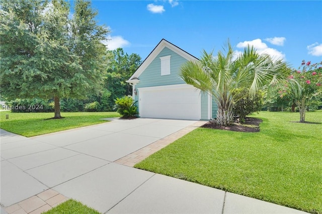 view of front of property with a garage and a front yard