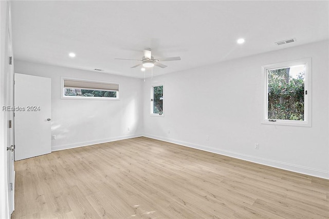 empty room featuring ceiling fan and light wood-type flooring